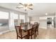 Dining room with dark wood table and kitchen view at 19767 E Thornton Rd, Queen Creek, AZ 85142