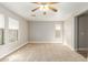 Bright bedroom with neutral walls and carpet at 19767 E Thornton Rd, Queen Creek, AZ 85142