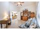 Spacious office with a comfortable couch, built-in shelving and view to living room at 3285 N 159Th Ave, Goodyear, AZ 85395