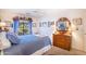 Cozy bedroom with double bed, dresser, and window with curtains at 3285 N 159Th Ave, Goodyear, AZ 85395