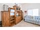 Bright office with wooden shelving, a comfortable couch and natural light at 3285 N 159Th Ave, Goodyear, AZ 85395