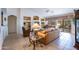 Bright living room with built-in shelving and tile floors at 3285 N 159Th Ave, Goodyear, AZ 85395