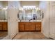 Double vanity bathroom with tiled flooring and a walk-in shower at 3285 N 159Th Ave, Goodyear, AZ 85395
