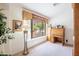 Home office featuring a desk, built-in shelving, and a view of the backyard at 3285 N 159Th Ave, Goodyear, AZ 85395