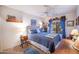 Cozy guest bedroom with a ceiling fan and charming decor at 3285 N 159Th Ave, Goodyear, AZ 85395