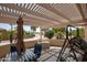 Covered patio with pergola, seating area, and golf course view at 3285 N 159Th Ave, Goodyear, AZ 85395