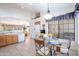 Bright kitchen with breakfast nook, ample cabinetry, and stainless steel appliances at 3285 N 159Th Ave, Goodyear, AZ 85395