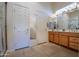 Bathroom features double sinks, tiled floors, and walk-in shower at 3285 N 159Th Ave, Goodyear, AZ 85395