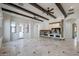 Living room with wood beam ceilings, tile floors and a fireplace at 207 N Parkview Ct, Litchfield Park, AZ 85340