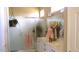 Elegant bathroom with double sinks and a large shower at 15576 W Coral Pointe Dr, Surprise, AZ 85374