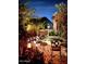 Romantic patio with wrought iron furniture and lighting at 15576 W Coral Pointe Dr, Surprise, AZ 85374