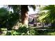 Lush backyard with covered patio and seating area at 15576 W Coral Pointe Dr, Surprise, AZ 85374