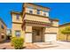 Two-story house with tan exterior, two-car garage, and landscaping at 11210 W Mckinley St, Avondale, AZ 85323