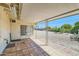 Covered patio with tile flooring and view of backyard at 10619 W Clair Dr, Sun City, AZ 85351