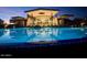 Resort-style community pool and clubhouse with stunning night lighting at 31985 N 117Th Ave, Peoria, AZ 85383
