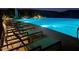 Community pool with plenty of lounge chairs for relaxing at 31985 N 117Th Ave, Peoria, AZ 85383