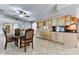 Bright dining area with a view into the kitchen at 19434 N 130Th Ave, Sun City West, AZ 85375