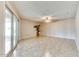 Living room with tile floors and sliding glass doors at 19434 N 130Th Ave, Sun City West, AZ 85375