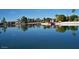 Calm lake with reflections of houses at 19434 N 130Th Ave, Sun City West, AZ 85375
