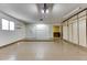 Spacious garage with ample storage cabinets and workshop area at 19434 N 130Th Ave, Sun City West, AZ 85375