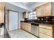 Kitchen with oak cabinets, granite countertops, and stainless steel dishwasher at 19434 N 130Th Ave, Sun City West, AZ 85375