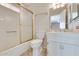 Clean bathroom with a shower/tub combo and white vanity at 19434 N 130Th Ave, Sun City West, AZ 85375