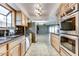 Modern kitchen with stainless steel appliances and a view to the dining area at 19434 N 130Th Ave, Sun City West, AZ 85375