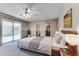 Virtually staged main bedroom with patio access and en-suite bathroom at 19434 N 130Th Ave, Sun City West, AZ 85375