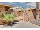 Private courtyard entry with wrought iron gates and brick walls at 19434 N 130Th Ave, Sun City West, AZ 85375