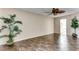 Bedroom with dark tile floors and ceiling fan at 19434 N 130Th Ave, Sun City West, AZ 85375