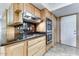 Kitchen with stainless steel appliances and oak cabinets at 19434 N 130Th Ave, Sun City West, AZ 85375