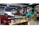 Large workshop with cars and tools at 19434 N 130Th Ave, Sun City West, AZ 85375