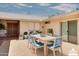 Patio with a staged dining area, ideal for outdoor entertaining at 19434 N 130Th Ave, Sun City West, AZ 85375
