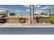 Brick ranch-style home with a courtyard entry and mature palm trees at 19434 N 130Th Ave, Sun City West, AZ 85375