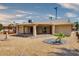 Landscaped backyard with covered patio, hot tub, and pergola at 19434 N 130Th Ave, Sun City West, AZ 85375