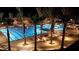 Large community pool and surrounding lounge area at night at 19434 N 130Th Ave, Sun City West, AZ 85375