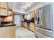 Modern kitchen with stainless steel appliances and oak cabinets at 19434 N 130Th Ave, Sun City West, AZ 85375