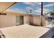 Spacious tiled patio with sliding glass door access and partial cover at 19434 N 130Th Ave, Sun City West, AZ 85375
