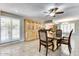 Dining area with a large table and built-in hutch at 19434 N 130Th Ave, Sun City West, AZ 85375
