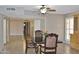 Dining area with granite table and view of hallway at 19434 N 130Th Ave, Sun City West, AZ 85375