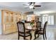 Spacious dining area with a granite top table and wood hutch at 19434 N 130Th Ave, Sun City West, AZ 85375