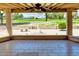 Covered patio overlooking a golf course with tiled floors at 19434 N 130Th Ave, Sun City West, AZ 85375