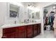 Double vanity bathroom with an updated look and a separate shower at 205 N 107Th Dr, Avondale, AZ 85323