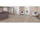 Spacious living room with light gray flooring and two armchairs at 501 E Ray Rd # 211, Chandler, AZ 85225