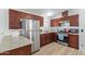 Modern kitchen with stainless steel appliances and dark wood cabinets at 501 E Ray Rd # 211, Chandler, AZ 85225