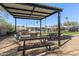 Outdoor kitchen and dining area with pergola and fire pit at 501 E Ray Rd # 211, Chandler, AZ 85225