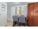 Bright dining area with table and four chairs, built in cabinets, and wood-look flooring at 501 E Ray Rd # 211, Chandler, AZ 85225
