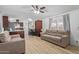 Open floor plan living room and kitchen with dark wood cabinets at 501 E Ray Rd # 211, Chandler, AZ 85225