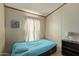 Cozy bedroom with a teal bedspread and built-in drawers at 501 E Ray Rd # 211, Chandler, AZ 85225