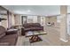 Living room with brown couches and wood-look flooring at 501 E Ray Rd # 211, Chandler, AZ 85225